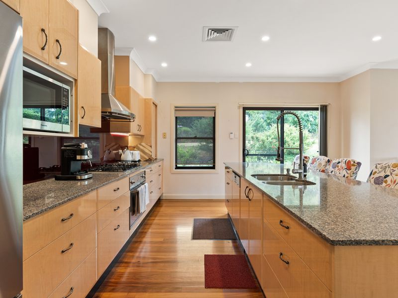 Fully equipped kitchen with high-end appliances and ample counter space.