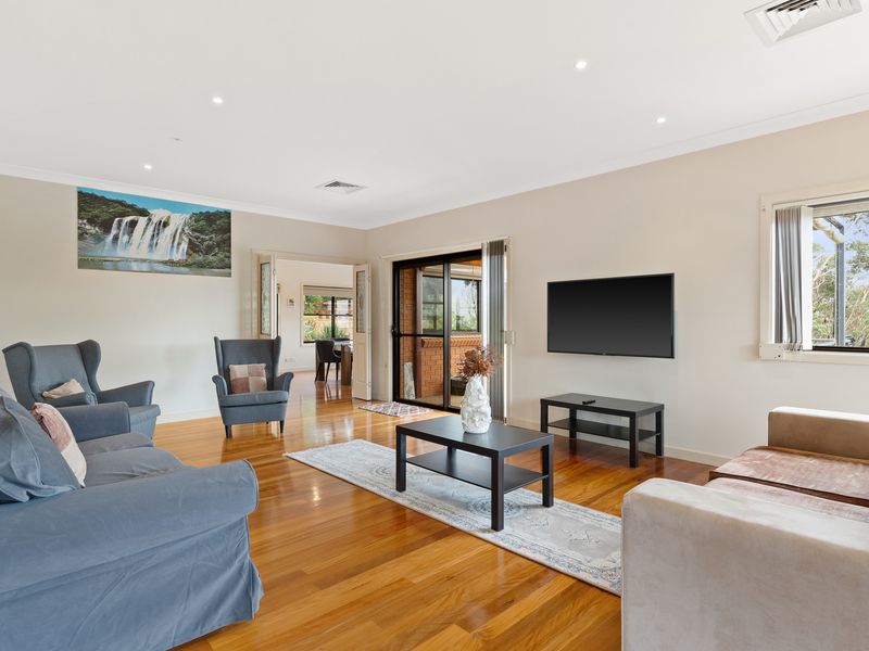 Stylish living area featuring a flat-screen TV for entertainment.