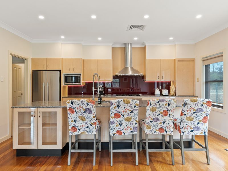 A well-equipped kitchen with plenty of seating for a group.