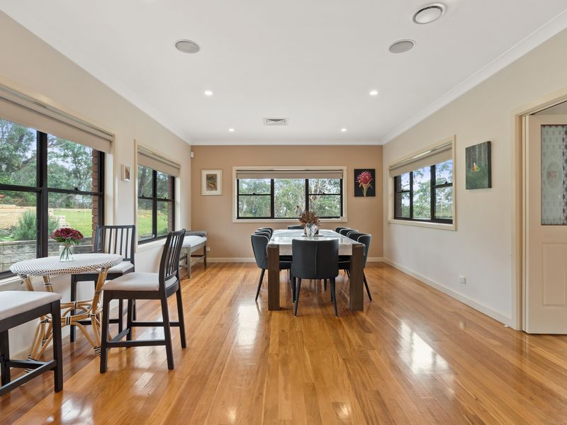 Relax in this welcoming dining room with picturesque views.