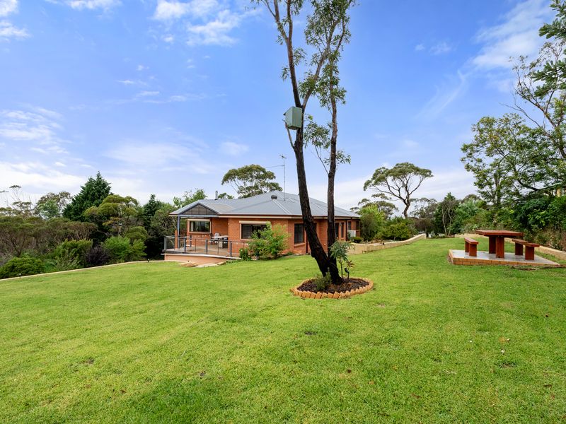 Step outside to the serene garden area, where you can take in the fresh air and beautiful surroundings.