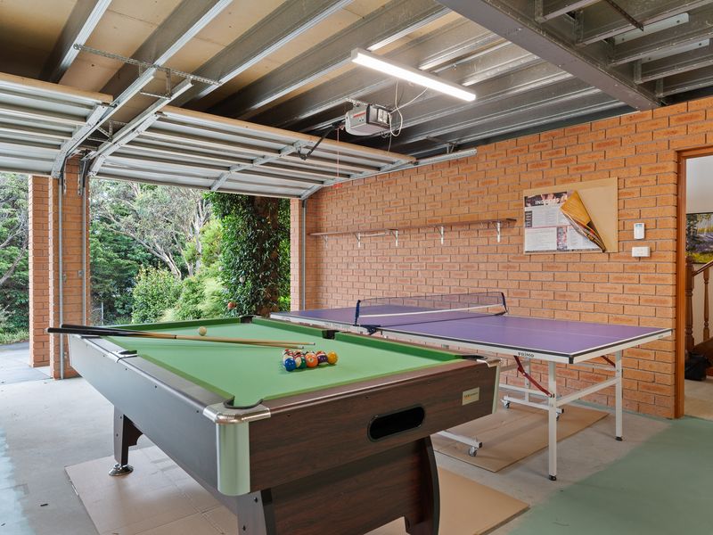 Challenge your friends to a game of pool or ping pong in this spacious entertainment room.
