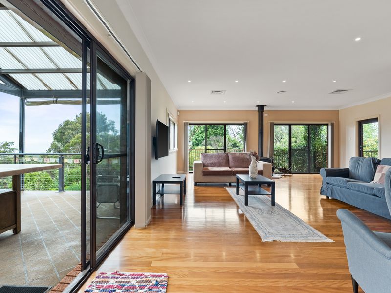 Comfortable seating and fresh air with easy access to the balcony.