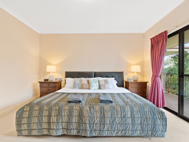 Stylish bedroom with modern furnishings and calming views of the surrounding landscape. Your peaceful getaway awaits.
