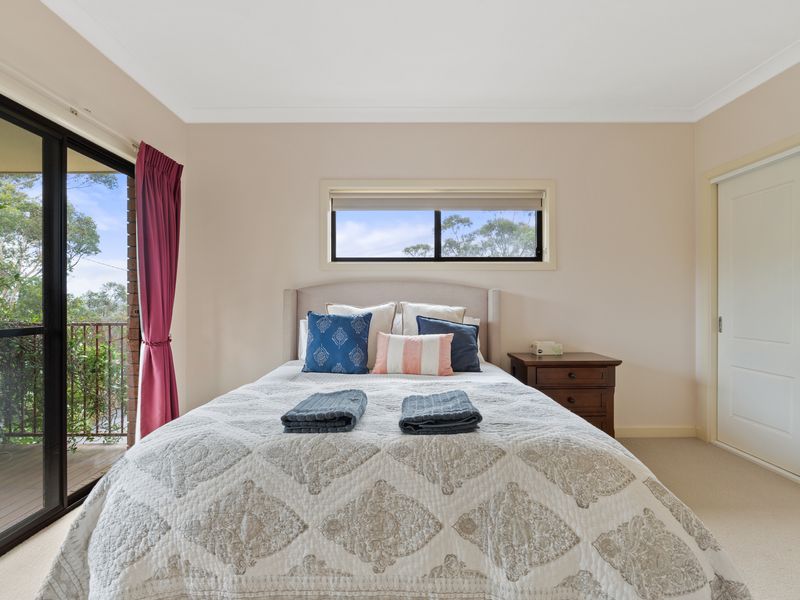 Wake up to scenic views right from the comfort of your bed, with easy access to the balcony.