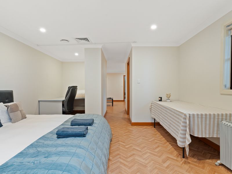 A comfortable space for rest and relaxation with a work desk area.