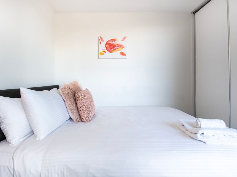 The bedroom features a comfortable queen-sized bed, perfect for a restful night's sleep.