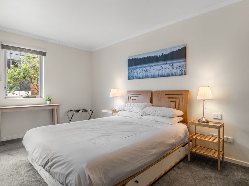 Serene & Stylish Bedroom – Unwind in this cozy retreat featuring a plush queen bed and elegant décor.