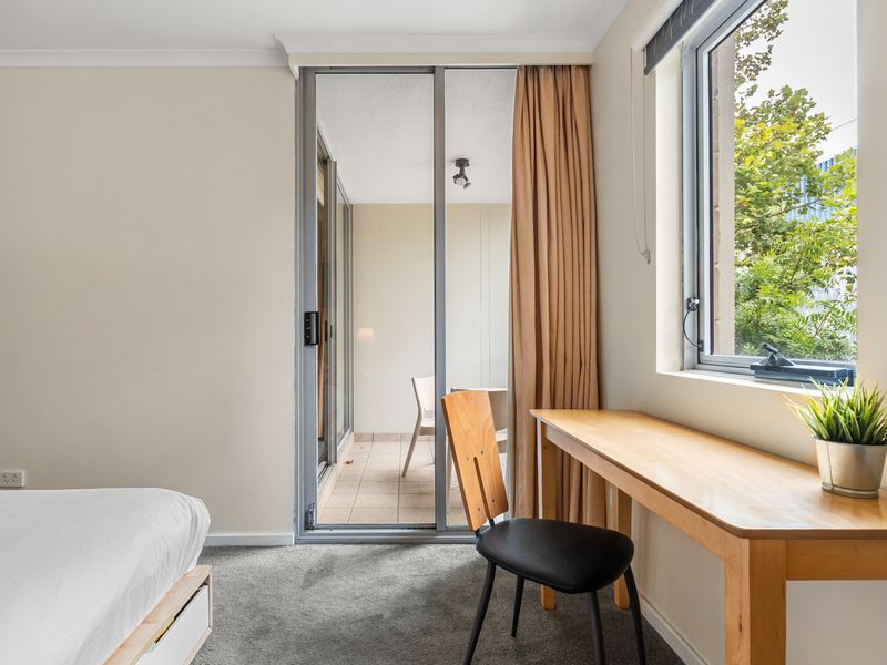 Work with a View – Enjoy a peaceful workspace with a window overlooking lush greenery.