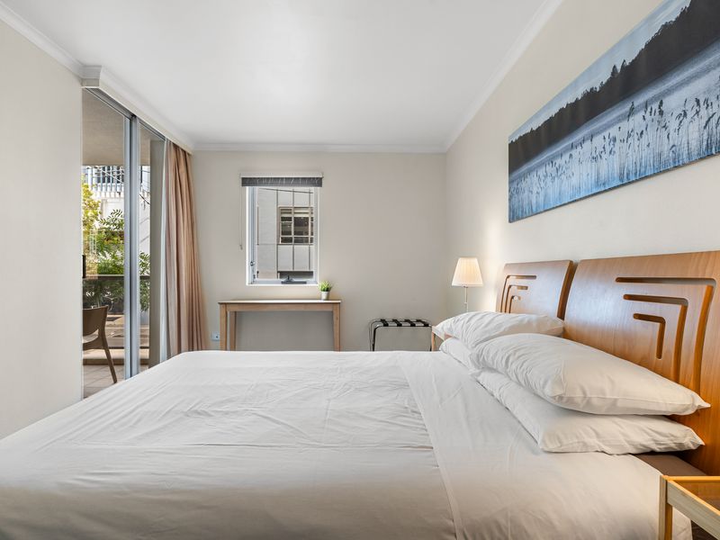 Bright & Airy Space – Large windows and a balcony door let in plenty of natural light for a refreshing stay.