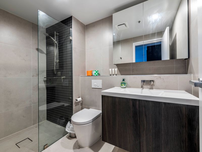 Spacious modern shower and sink.