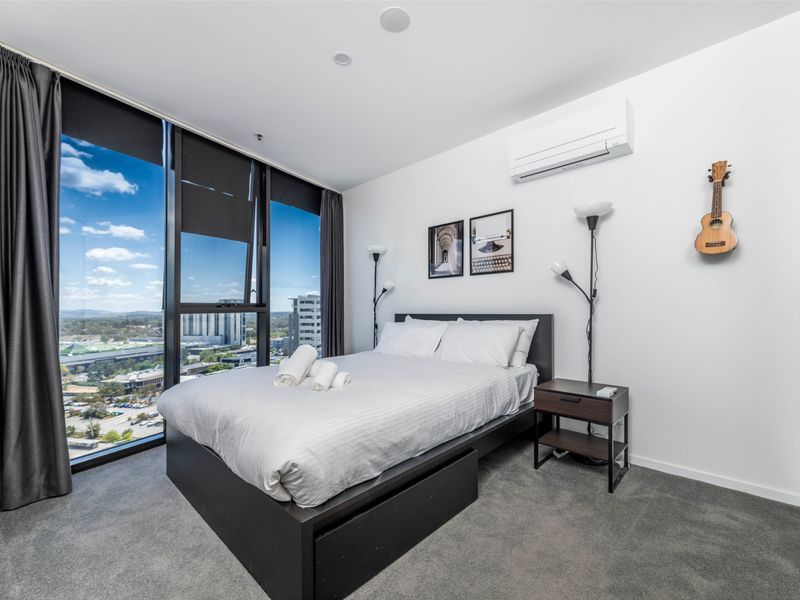 Bright bedroom with city view.