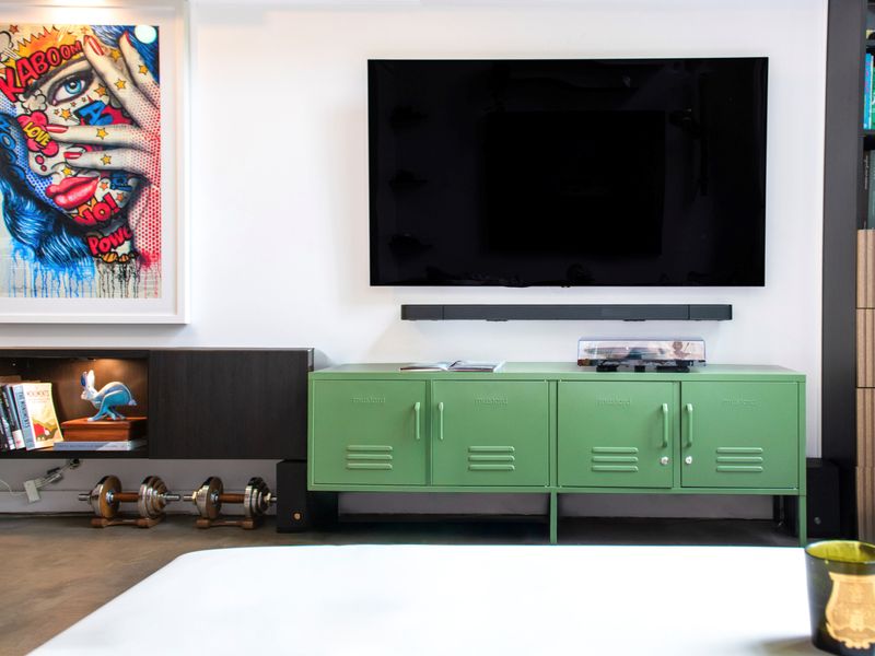 Functional yet stylish, this TV console blends seamlessly with the modern aesthetic of the living space.