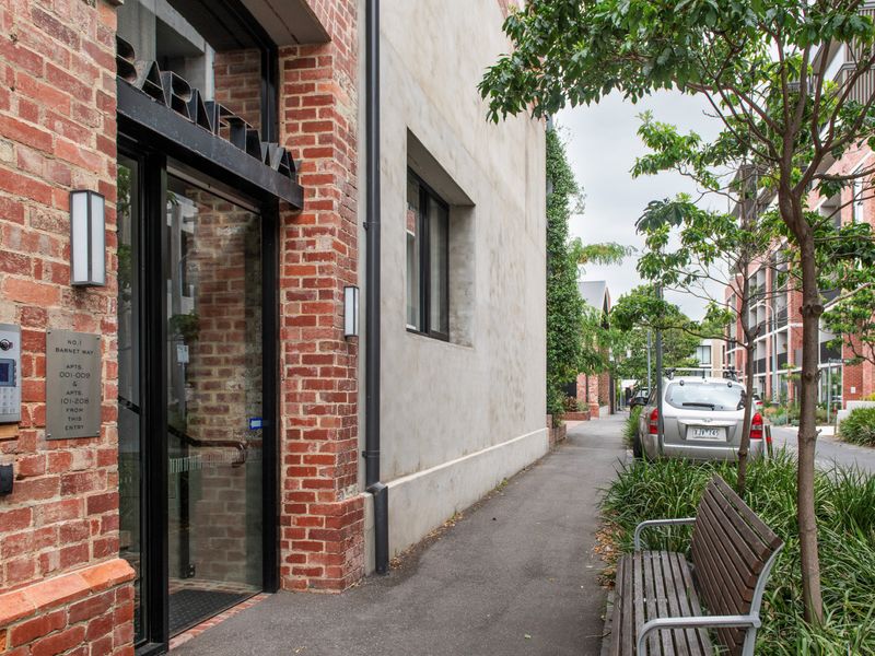 Your gateway to a peaceful, stylish retreat — the entrance to this modern Richmond apartment is both inviting and secure.