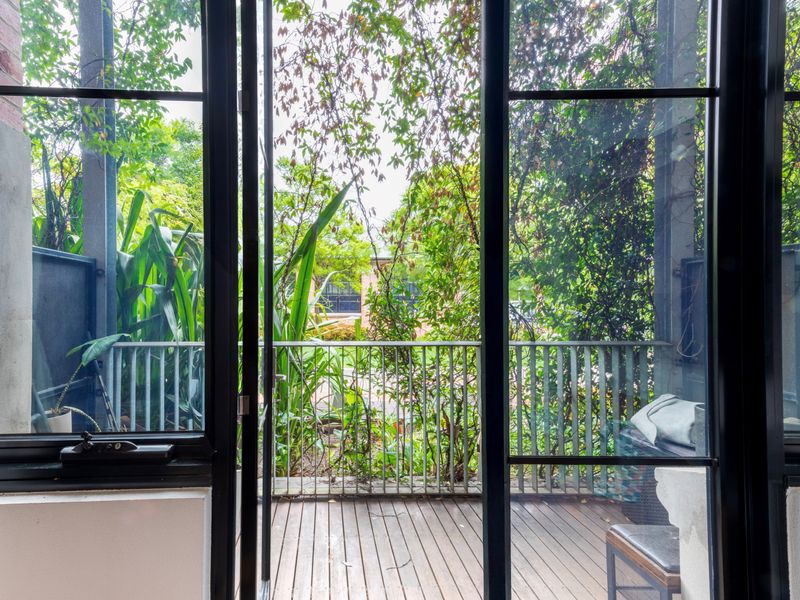 Step out onto the deck from the living room and take in the peaceful surroundings with a perfect view of the area.