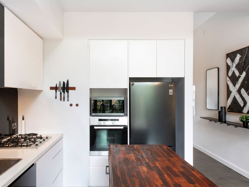 Gather around this rustic kitchen island — the heart of the home, perfect for meal prep or socializing.