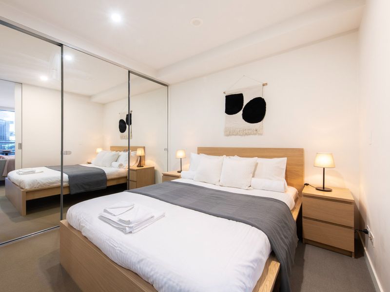 Cozy bedroom featuring a comfortable queen bed for restful sleep