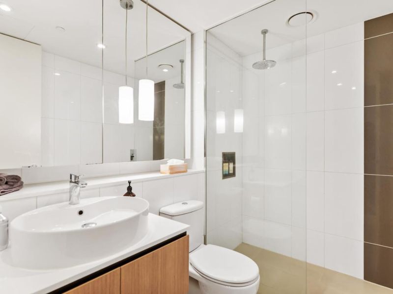 Clean bathroom with toilet and shower