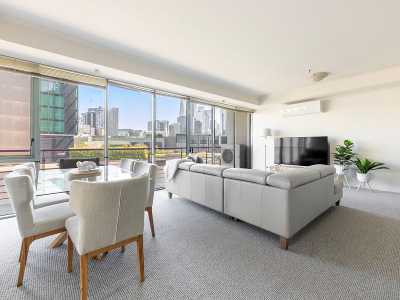 Dining and living areas with city view