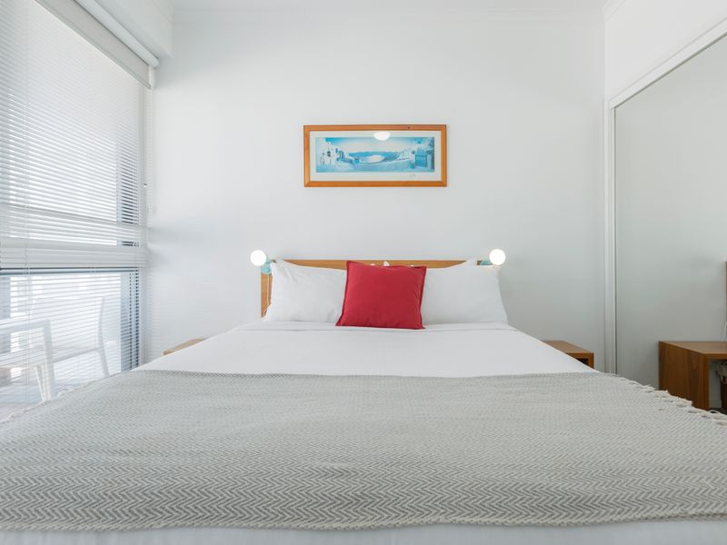 Alternative view of the first bedroom showing the comfortable double bed and bright, calming interior.