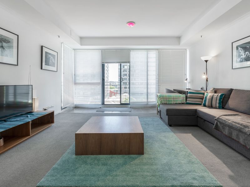 Living room with plush seating and entertainment area designed for comfortable evenings in.