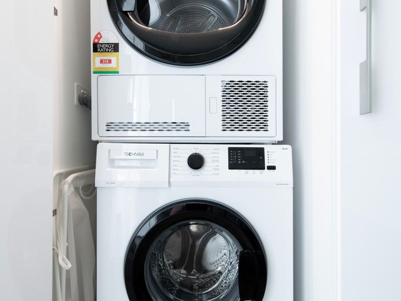 In-unit laundry with washer and dryer for guest convenience.