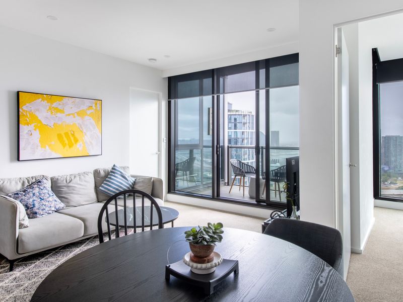 Open-plan lounge area with modern furnishings and natural light.