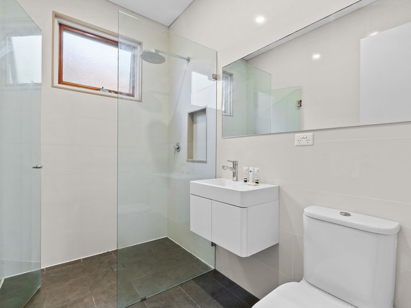A modern and spacious bathroom designed for ultimate relaxation.
