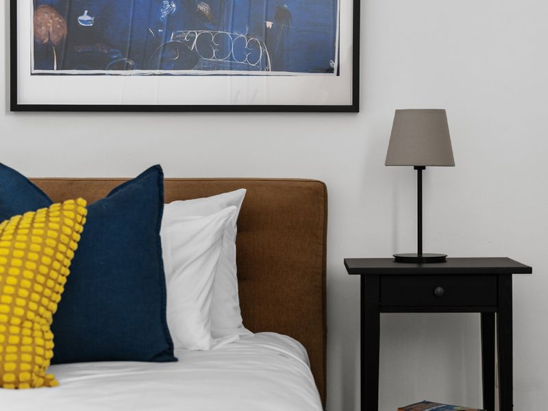 A cozy haven with bright pops of yellow and blue.