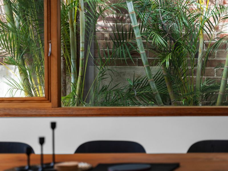 Enjoy dining with a view of lush greenery through the large window.