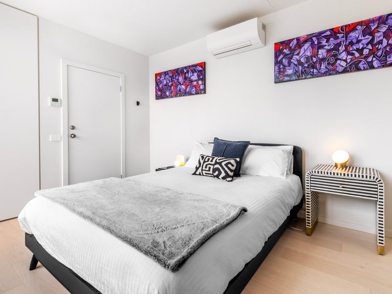 Cozy Master bedroom with contemporary decor and plush bedding.
