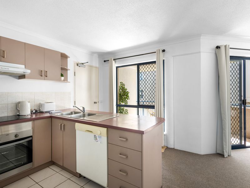 Open and inviting kitchen space with ample benchtop area for cooking. The layout provides a quick connection to the living and dining areas, so you're never far from the action!