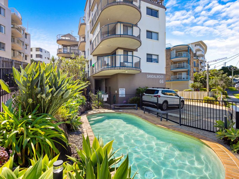 Coastal living at its best. Secure building entrance, on-site parking, and a welcoming pool area.