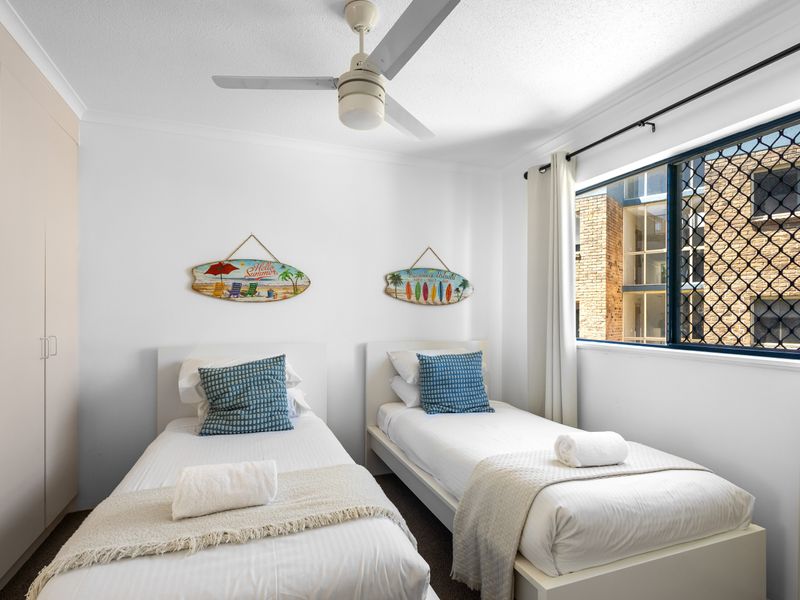 This room is set up for flexible sleeping arrangements, featuring two comfortable beds.