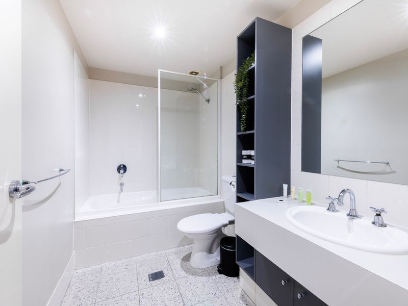 Clean bathroom with bathtub