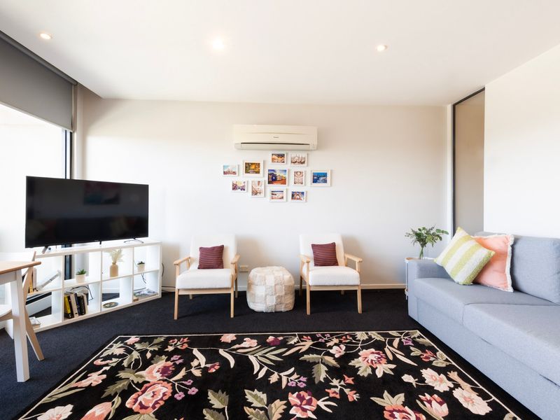 Large TV room with couch and coffee table