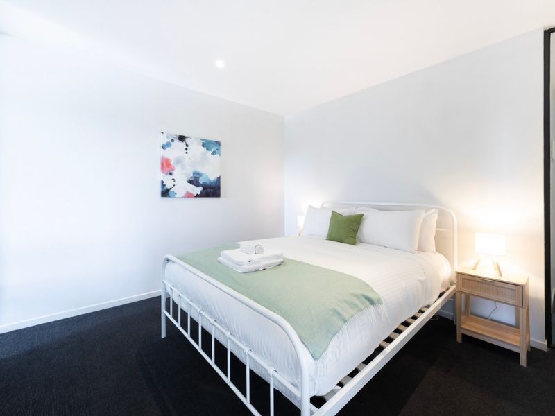 Comfortable bedroom featuring a queen bed for a restful night's sleep