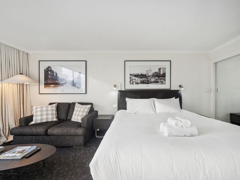 A perfect spot to unwind after a day of exploring the city, complete with a comfortable bed and chic décor.