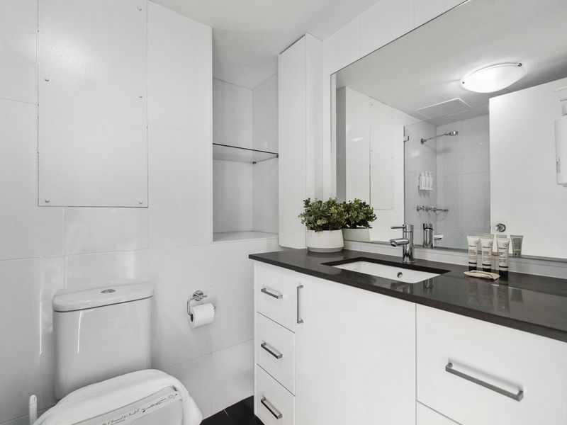 Enjoy a bright and spacious bathroom featuring a clean, contemporary design.