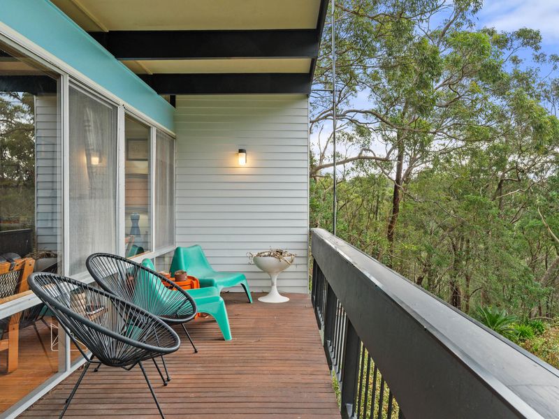 Balcony seating area perfect for unwinding amongst the greenery.