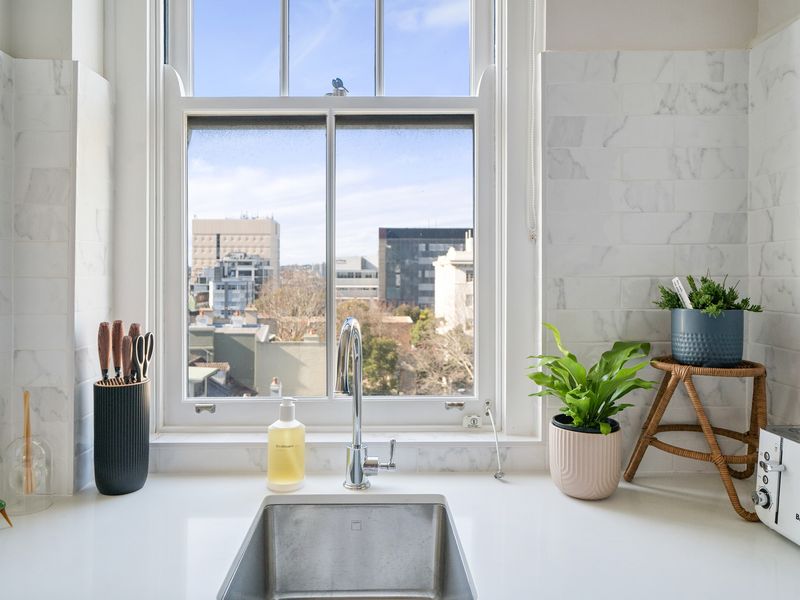 Morning light and city views from the kitchen sink.