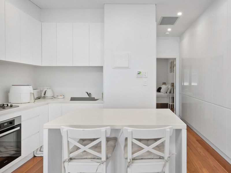 Minimalist design meets functional elegance in this stunning kitchen.