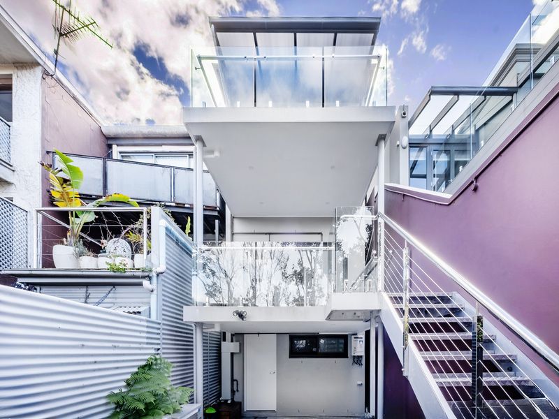 A contemporary home design maximizing vertical space and natural light.