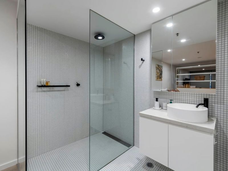 simple and elegant bathroom with glass enclosure