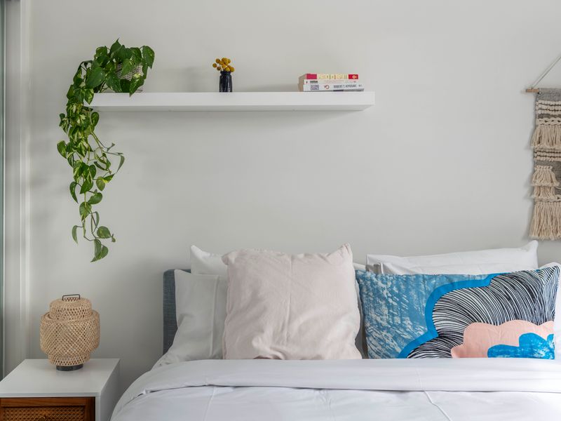 Bed styling complete with fresh pillows for a peaceful rest