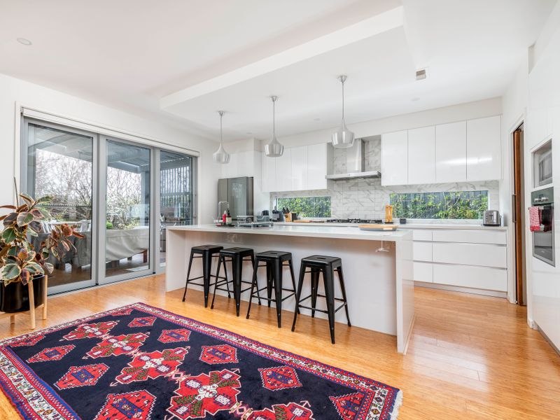 Bright kitchen with ample storage and bench space
