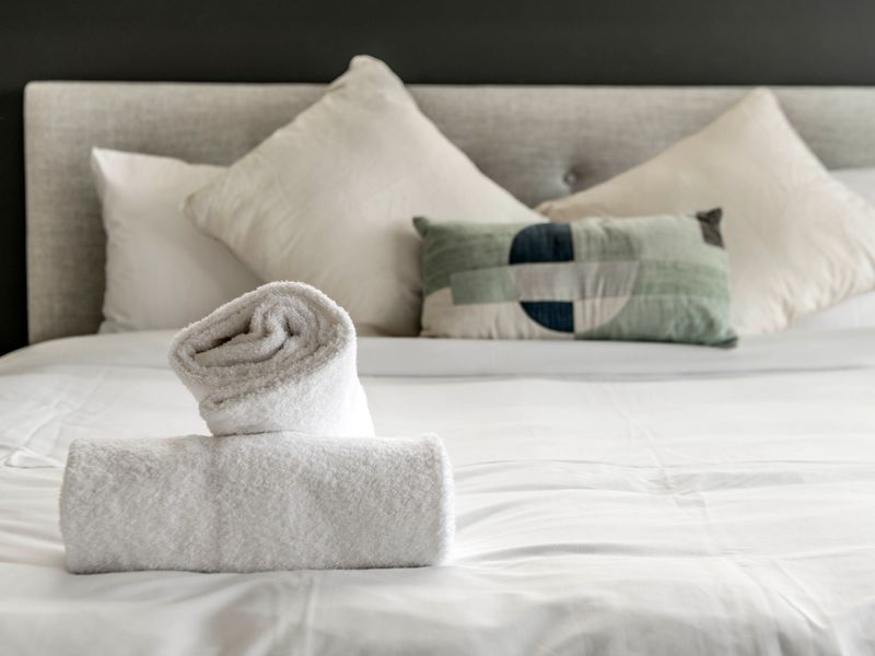 Comfortable bed with fresh linens.