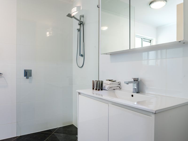 Modern comfort, sparkling clean bathroom with bath essentials to start up your stay