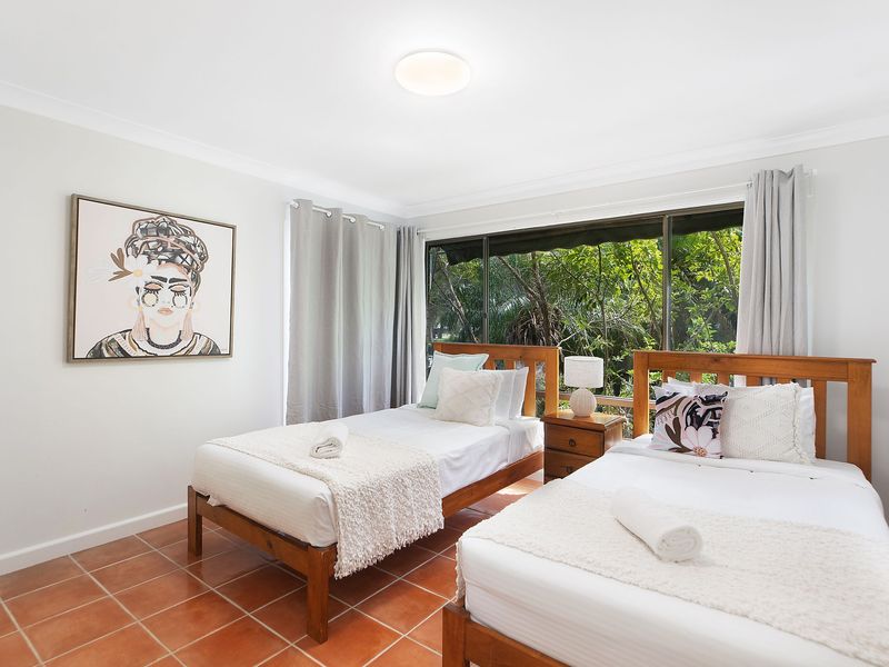 Downstairs bedroom with cozy furnishings