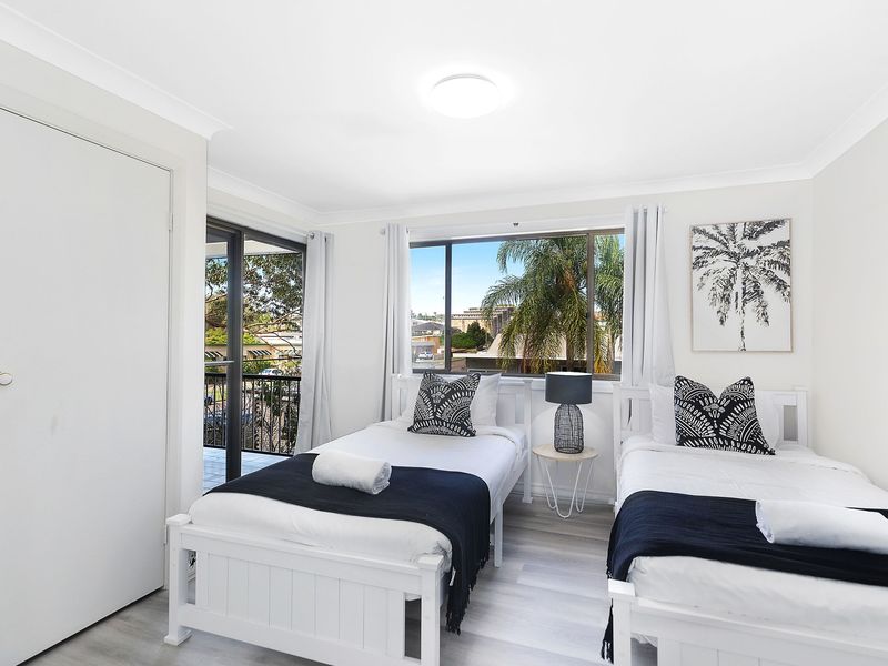 Upstairs bedroom with direct access to a private deck area